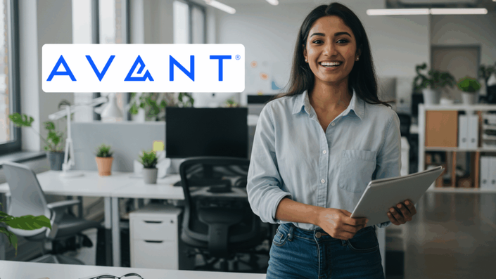 Smiling woman holding a tablet and standing in an office space with the Avant logo displayed at the top.