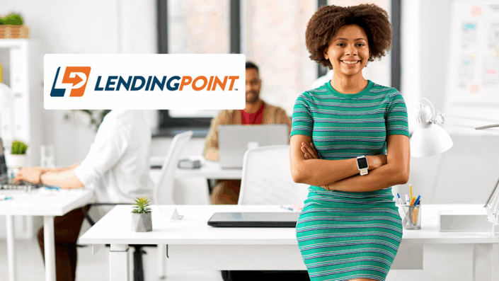 Confident woman standing with arms crossed in a bright office environment with colleagues working in the background, LendingPoint logo displayed on the left.